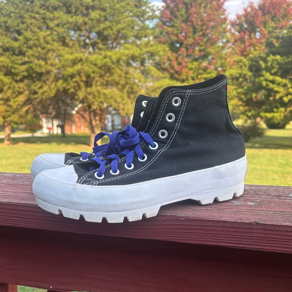 Stylish Black and White High-Top Sneakers with Purple Laces